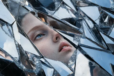 Portrait Of A Woman Behind Shattered Mirror Fragments