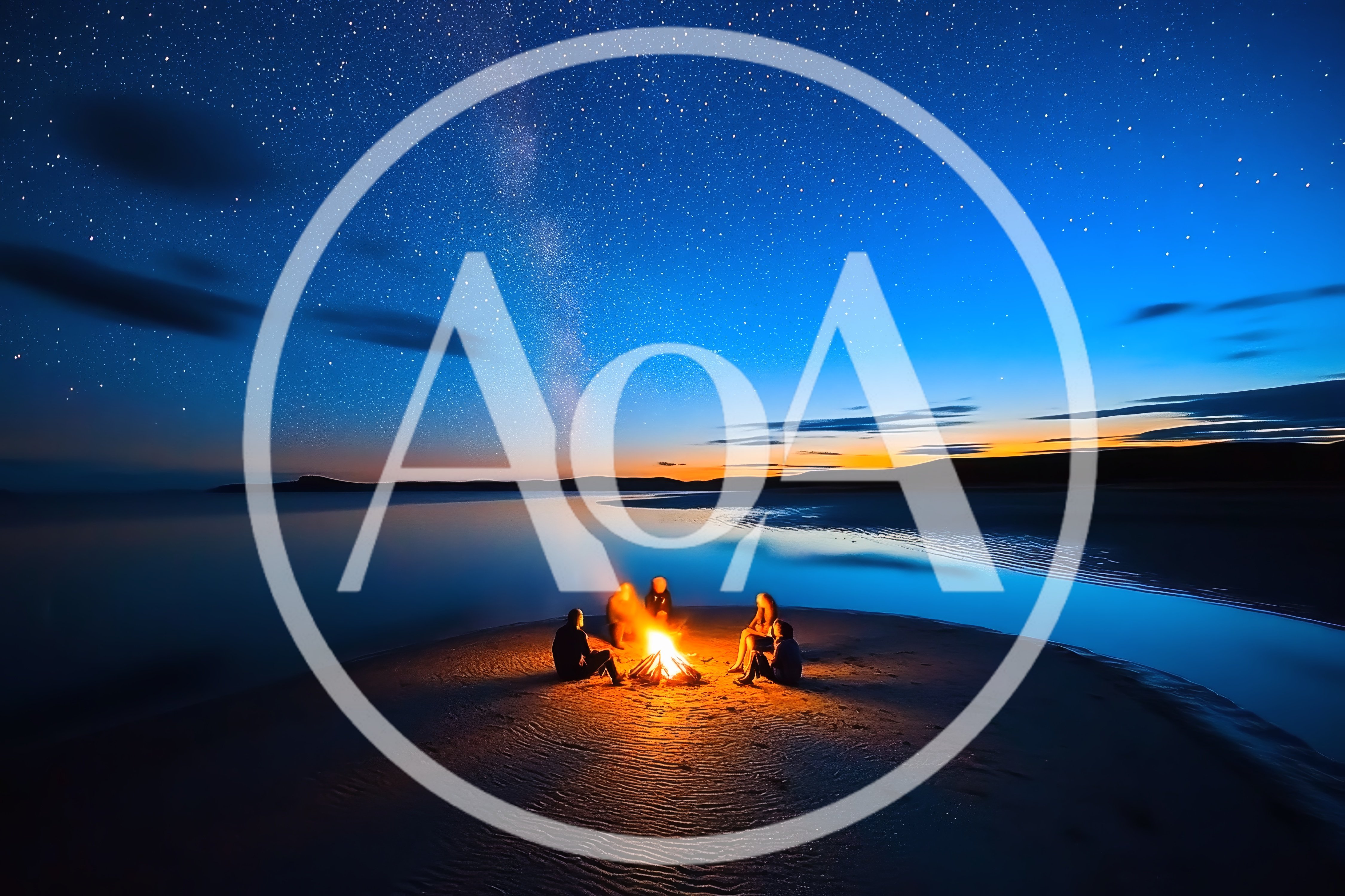 Friends Sitting Around A Campfire On A Beach At Night