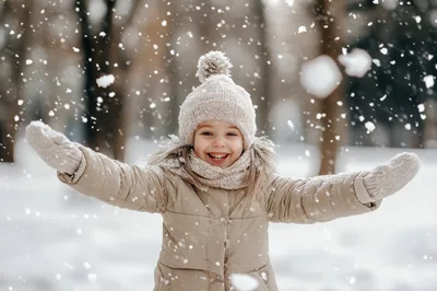 Happy Little Girl Playing In The Snow