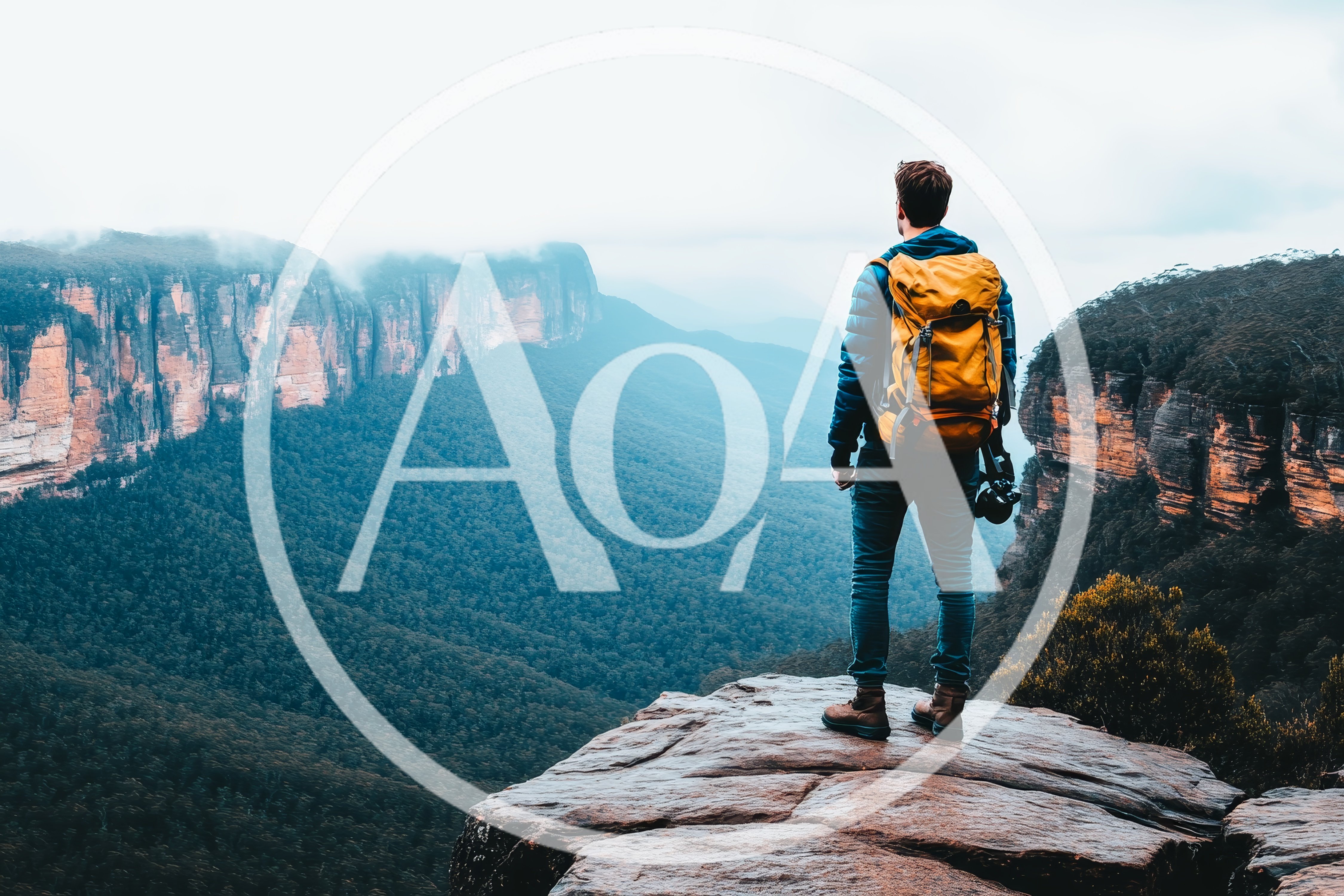 Hiker Standing On A Cliff Edge Overlooking A Valley