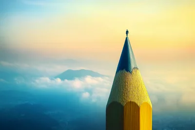 Conceptual Surreal Image Of A Person Standing On Pencil