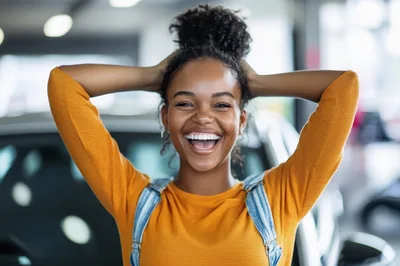 Joyful Young Woman Celebrating In A Car Dealership