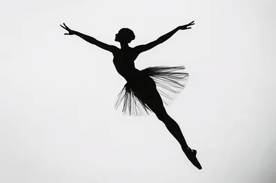 Silhouette Of A Ballerina Leaping In Mid Air