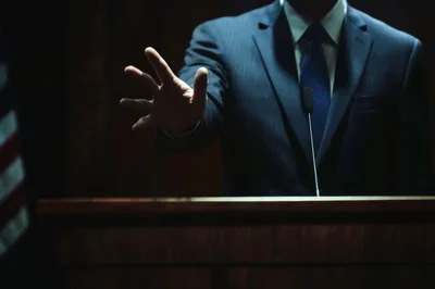 Politician Giving A Speech At A Podium