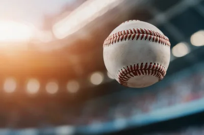 Baseball Flying Through The Air In A Stadium