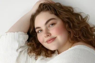 Portrait Of A Young Woman With Curly Hair