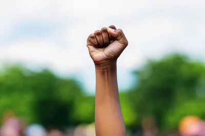 Raised Fist Symbolizing Protest And Social Justice