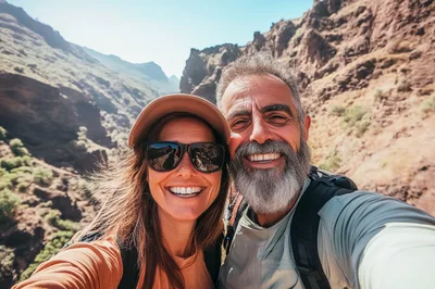 Happy Couple Taking Selfie During Mountain Hike