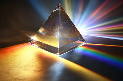 Glass Pyramid Refracting Light Into A Colorful Spectrum
