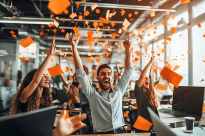 Excited Office Team Celebrating Success With Confetti