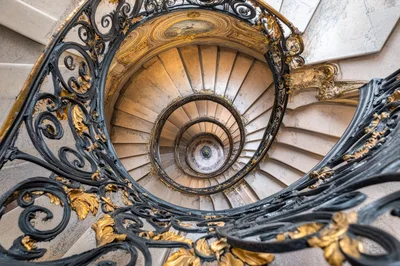 Ornate Spiral Staircase With Gold Leaf Detailing