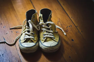 Pair Of Worn Yellow High Top Sneakers