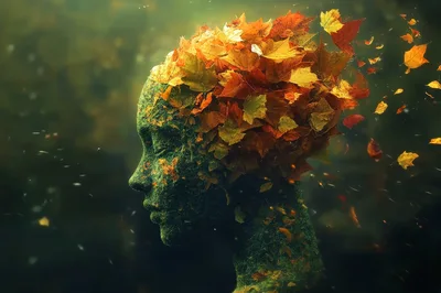 Surreal Human Head Sculpture Made Of Moss And Autumn Leaves