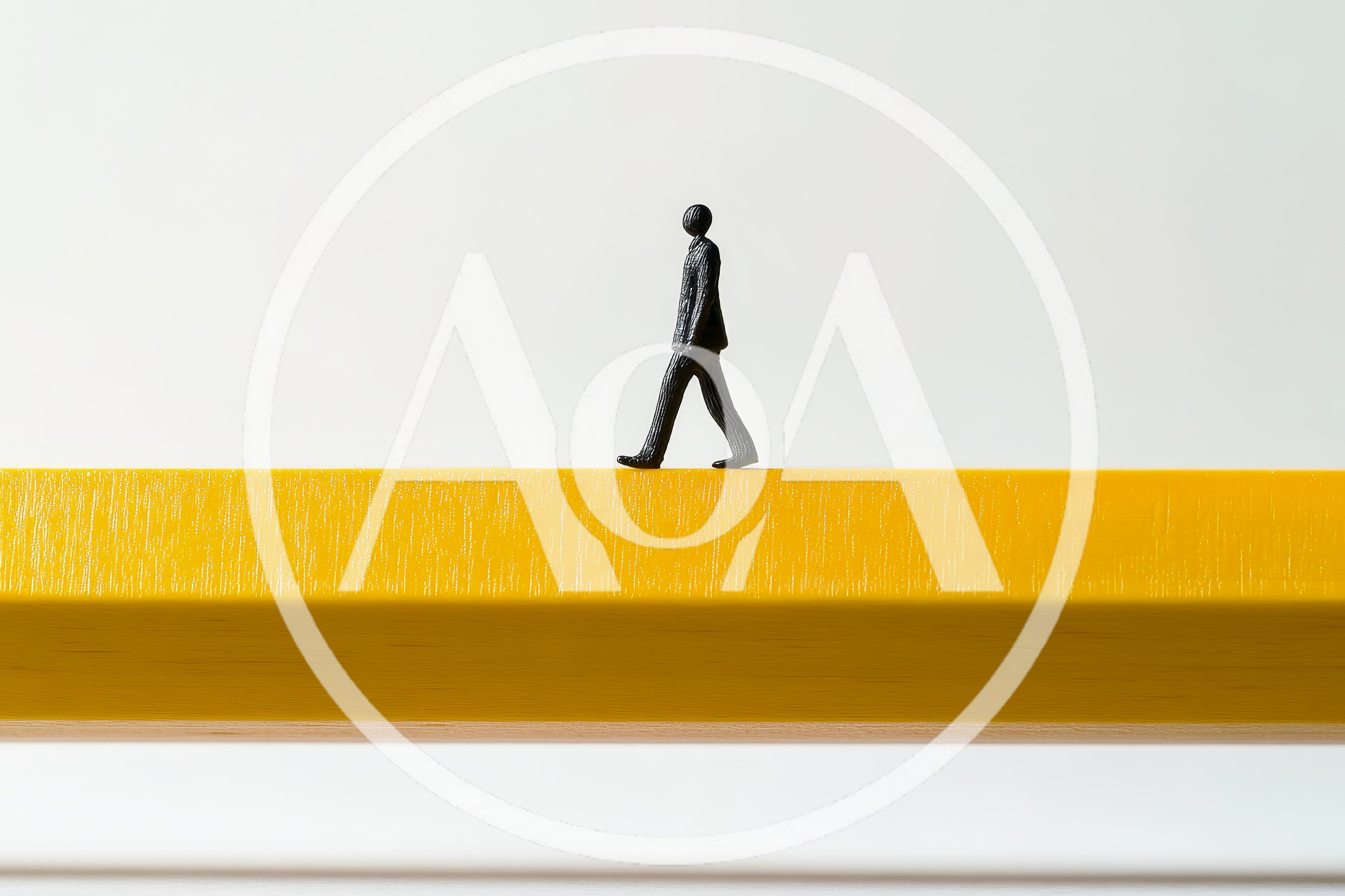 Miniature Business Figure Walking On A Yellow Pencil
