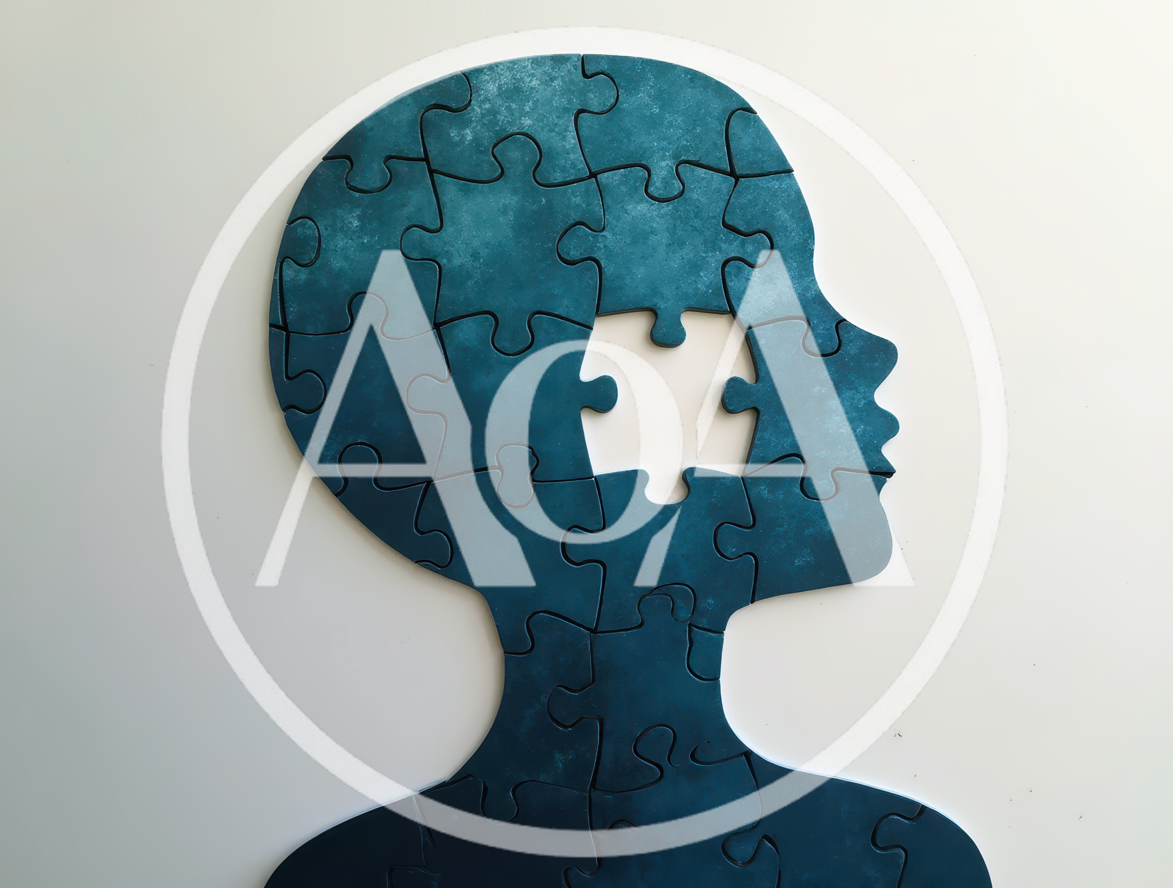 Human Head Silhouette Made Of Blue Jigsaw Puzzle Pieces