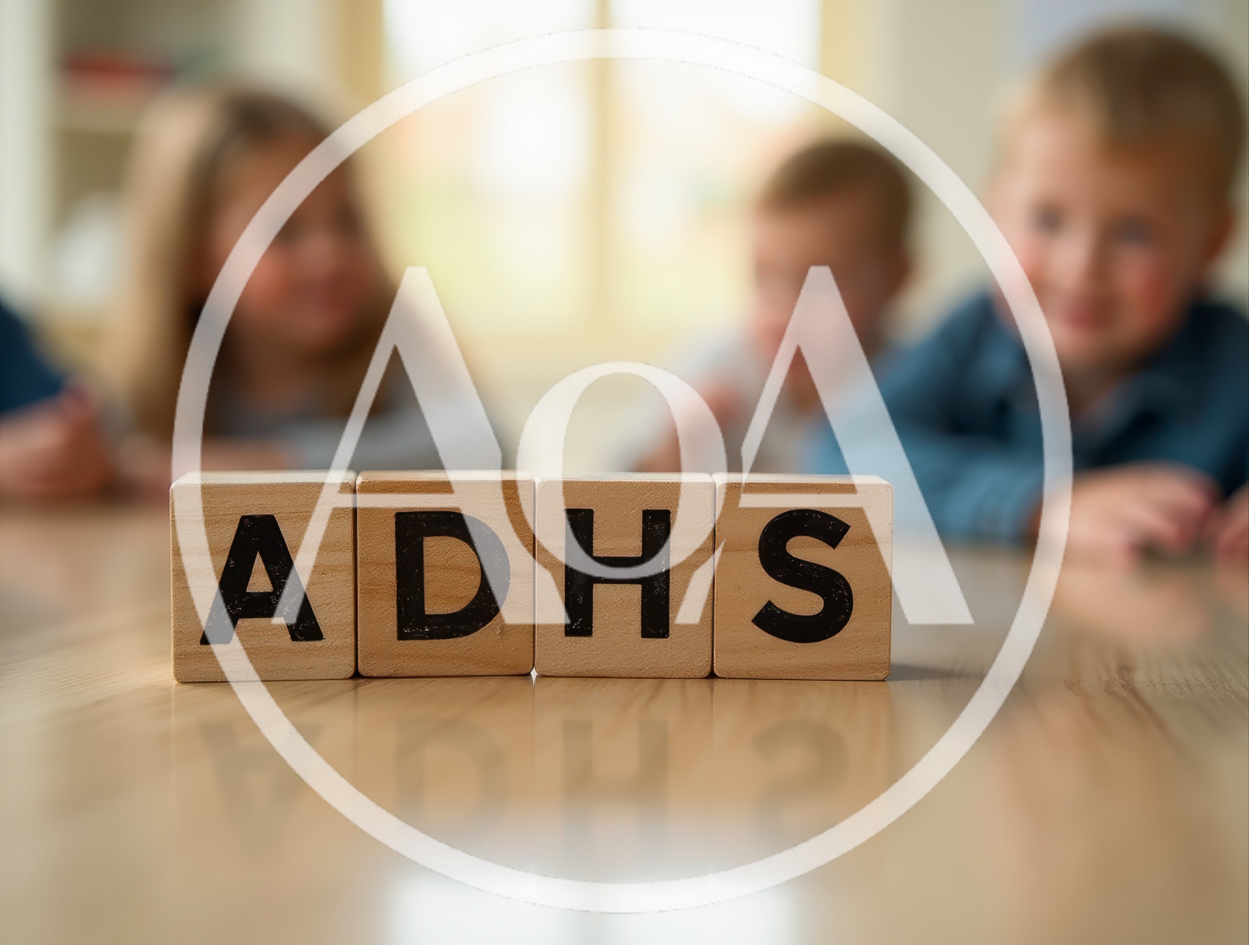 Wooden Blocks Spelling ADHS With Blurred Children In Background