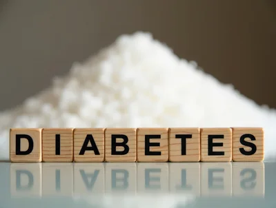 Wooden Blocks Spelling Diabetes With A Pile Of Sugar