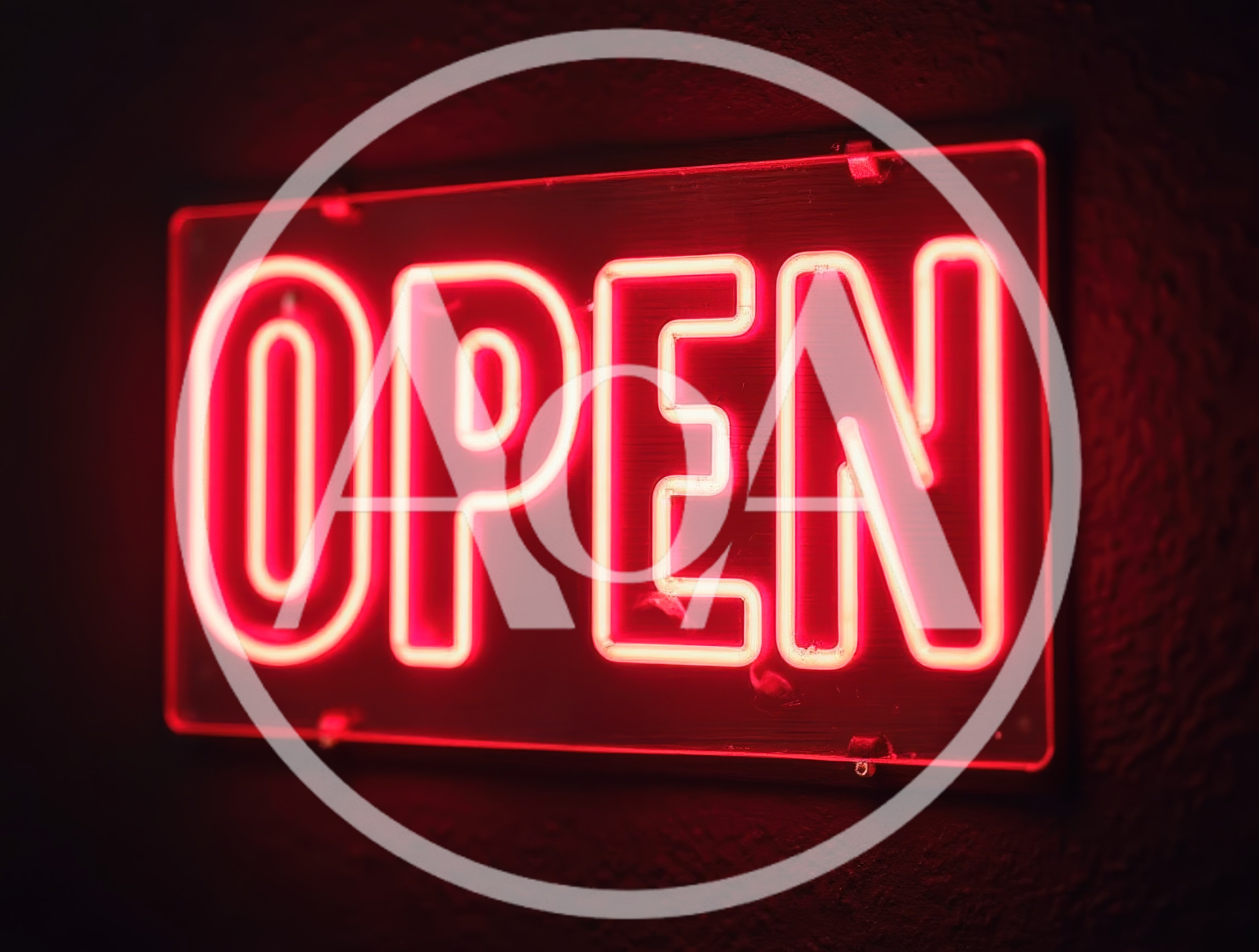 Red Neon Open Sign Glowing On Dark Wall