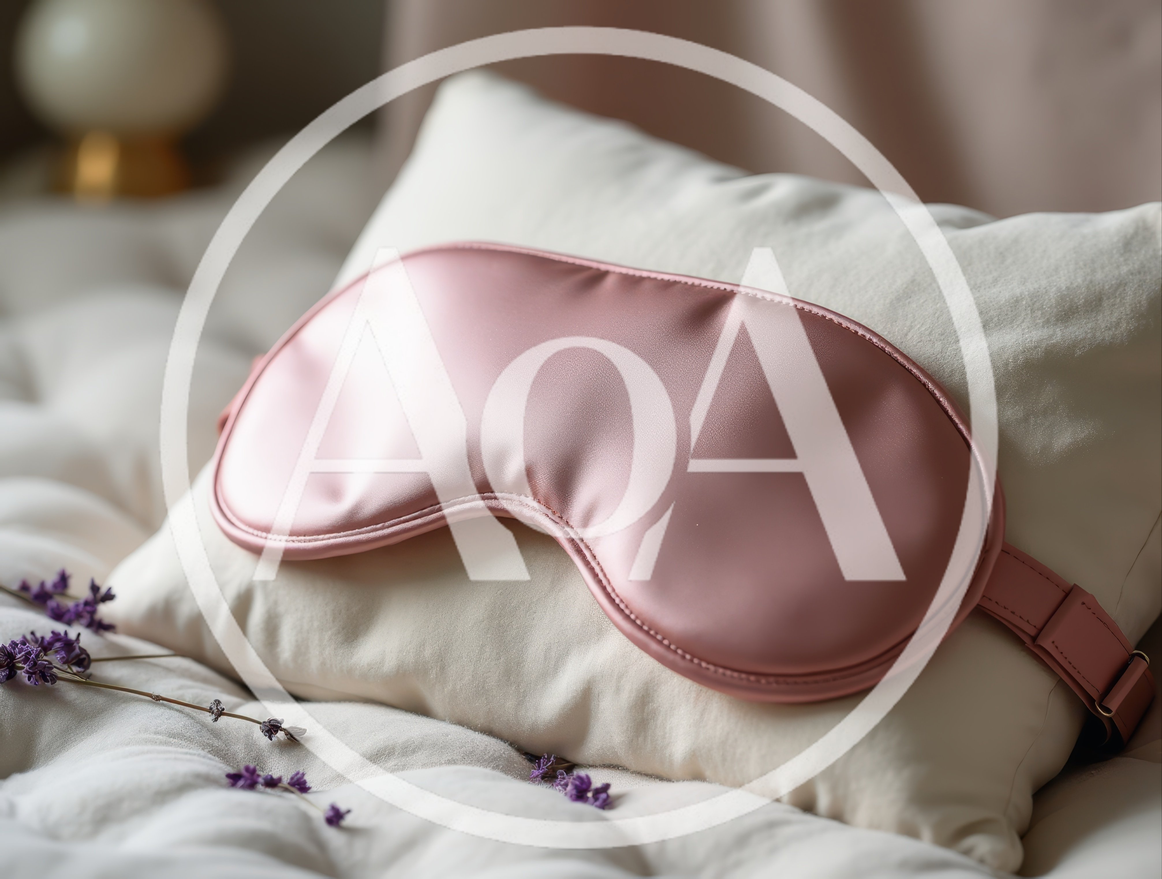 Pink Silk Sleep Mask Resting On A Soft Pillow