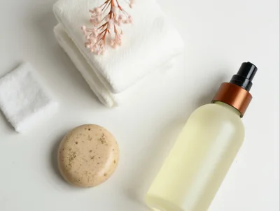 Skincare Products With Towels And Dried Flowers