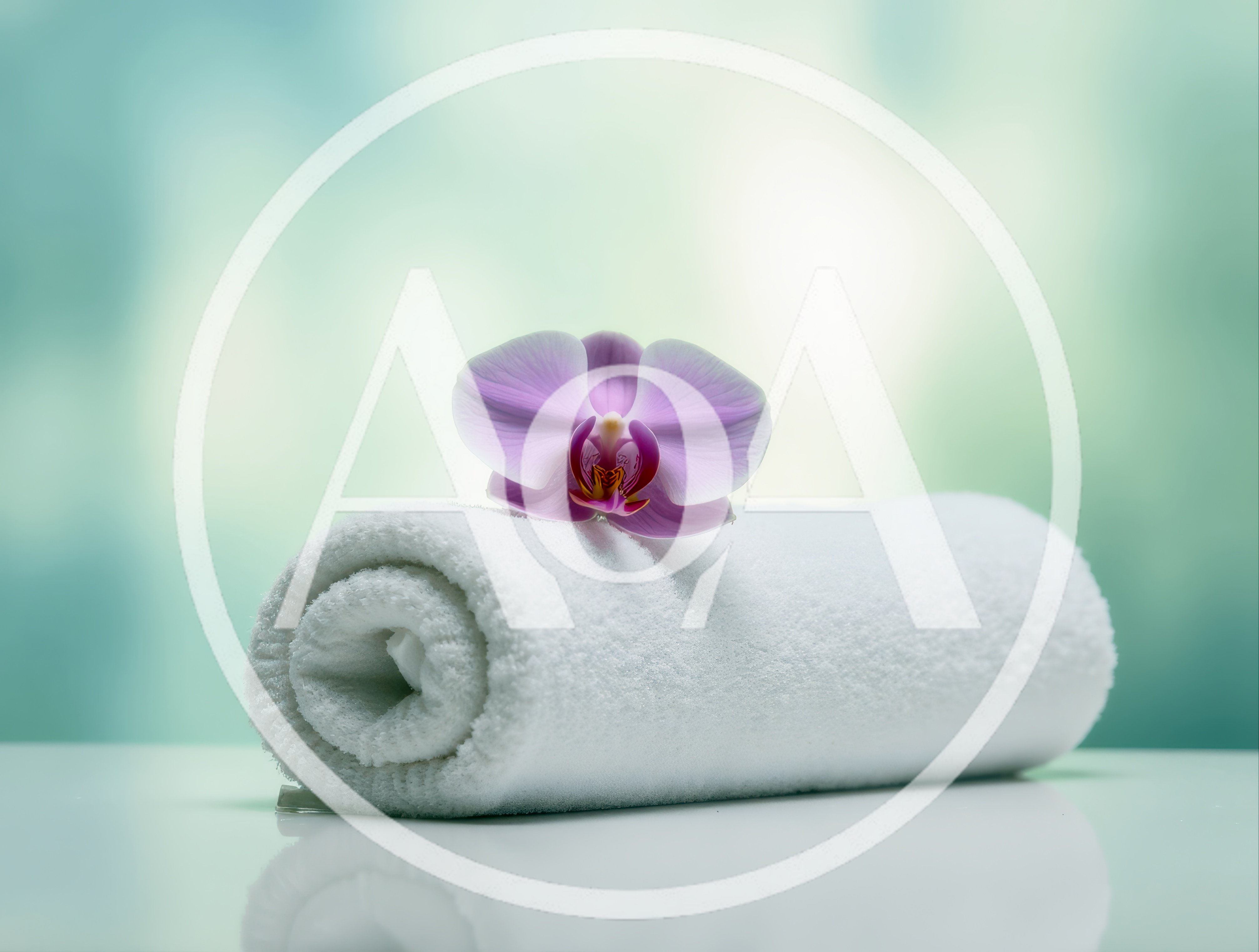 White Rolled Spa Towel With A Purple Orchid