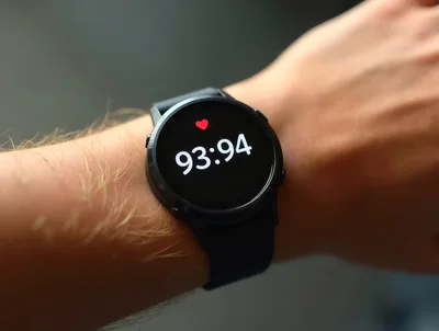 Smartwatch Displaying Heart Rate Data On A Wrist