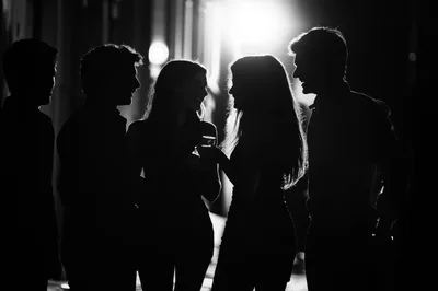 Group Of Friends Socializing At Night