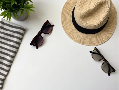 Summer Vacation Essentials Flat Lay on White Background