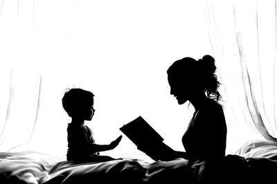 Silhouette of Mother Reading Book to Young Child