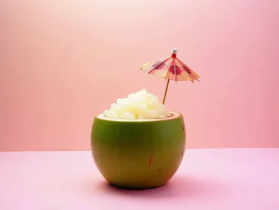 Fresh Coconut Dessert Served In A Green Coconut Shell