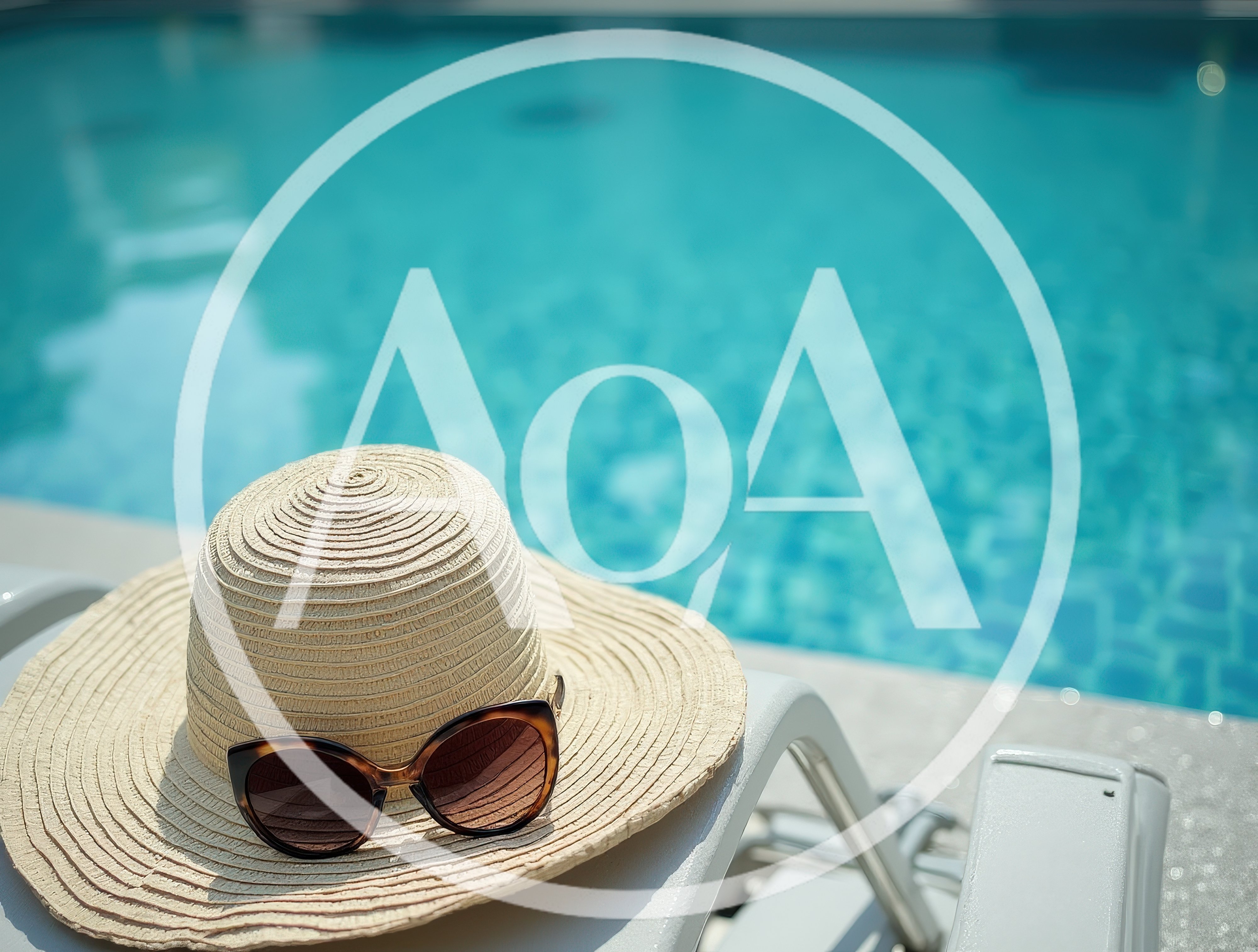 Sun Hat and Sunglasses on Poolside Lounge Chair
