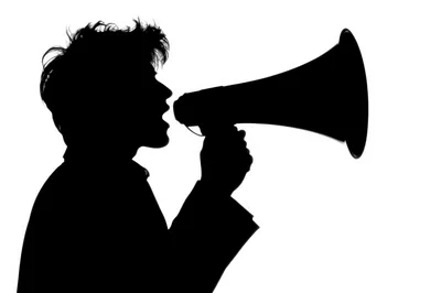 Silhouette Of A Person Speaking Into A Megaphone