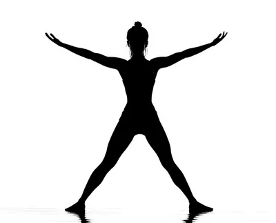 Silhouette Of A Woman Performing Yoga Pose