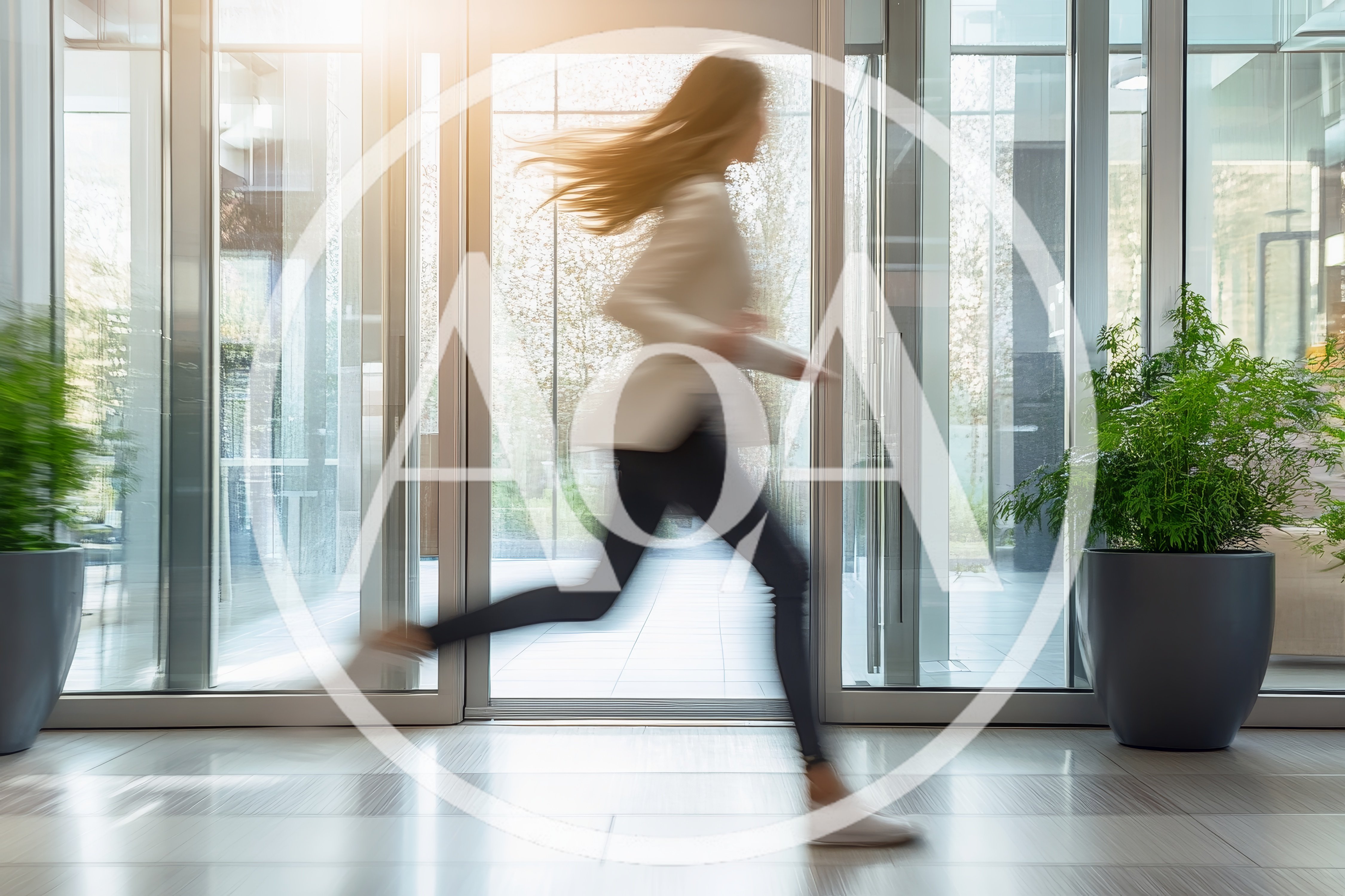 Businesswoman Running Through Modern Office Building Lobby