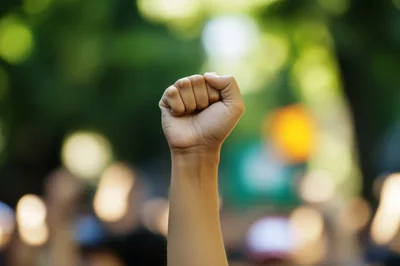 Raised Fist Symbolizing Protest And Social Justice