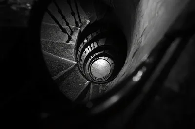Spiral Staircase Looking Down Into Dark Void