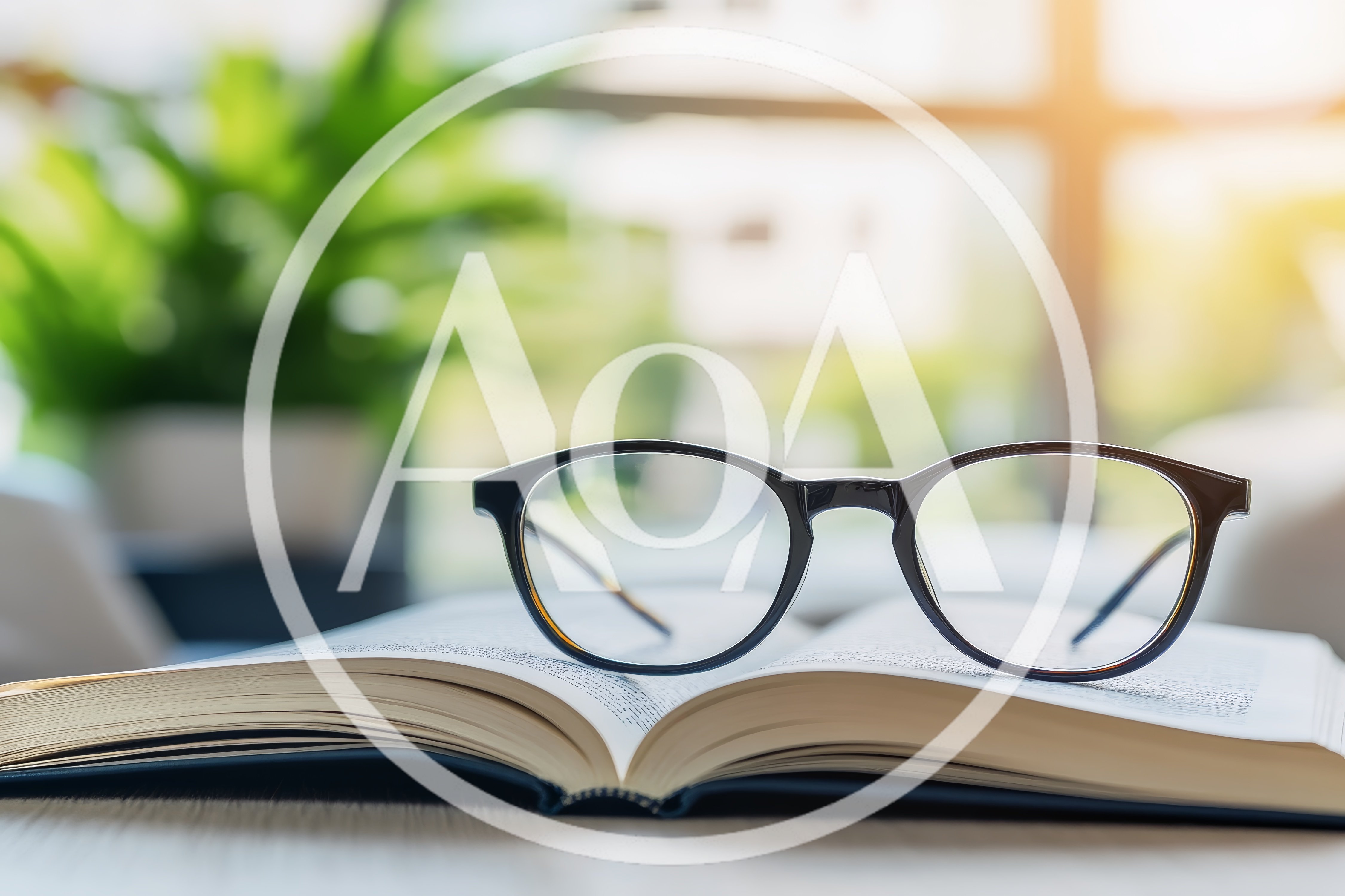 Black Rimmed Glasses Resting On An Open Book