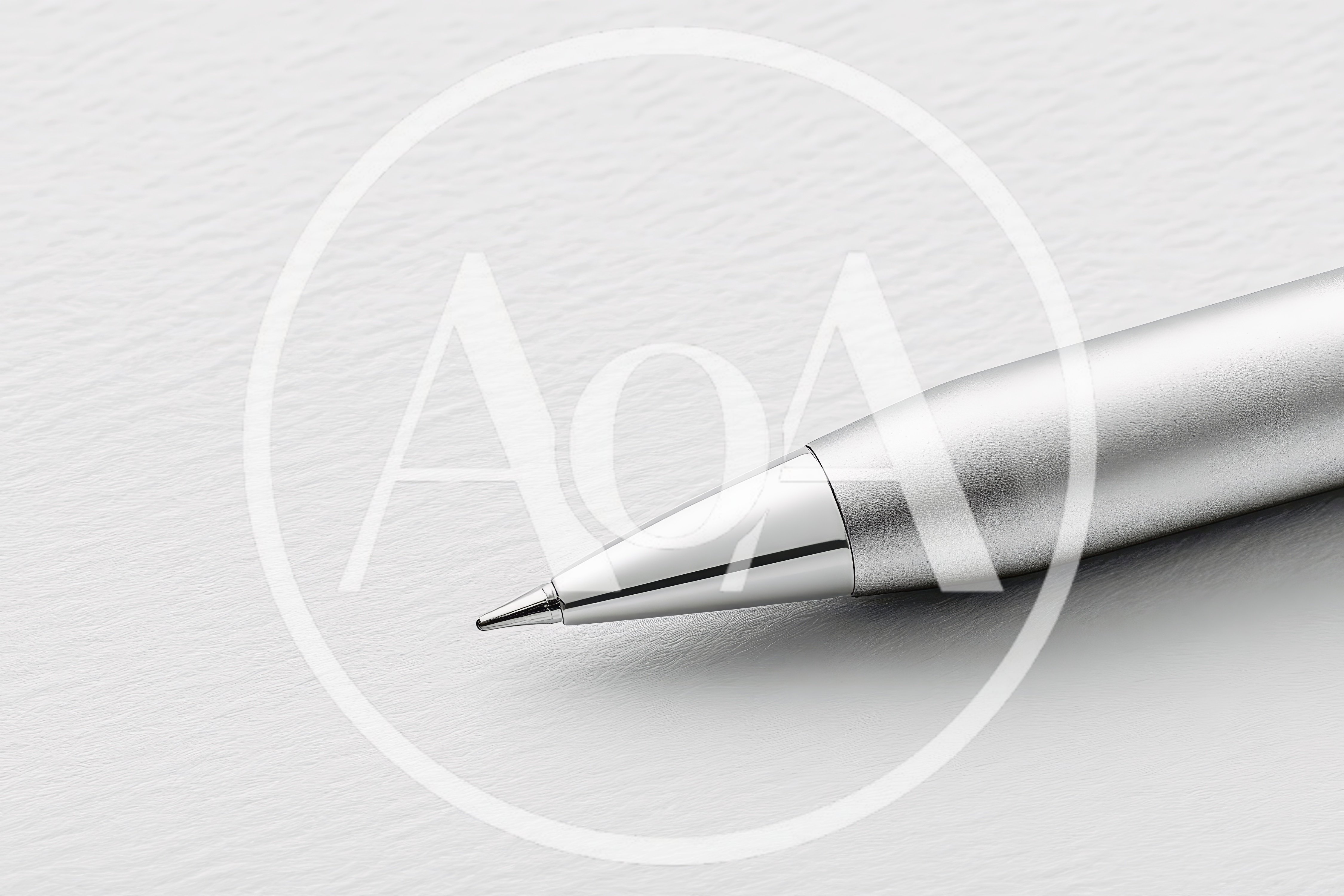 Close Up Of A Silver Ballpoint Pen On Paper