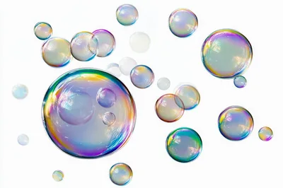 Floating Iridescent Soap Bubbles On White Background