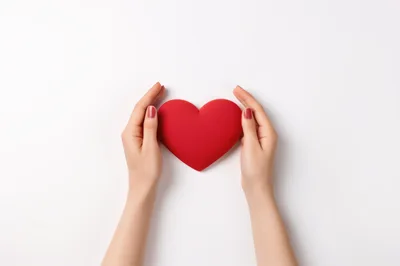 Woman Holding A Red Heart Shape