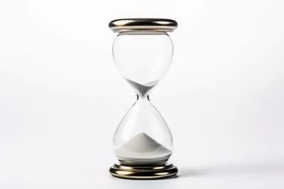Classic Hourglass With White Sand On White Background