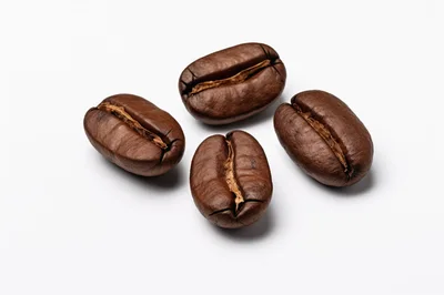 Four Roasted Coffee Beans On White Background