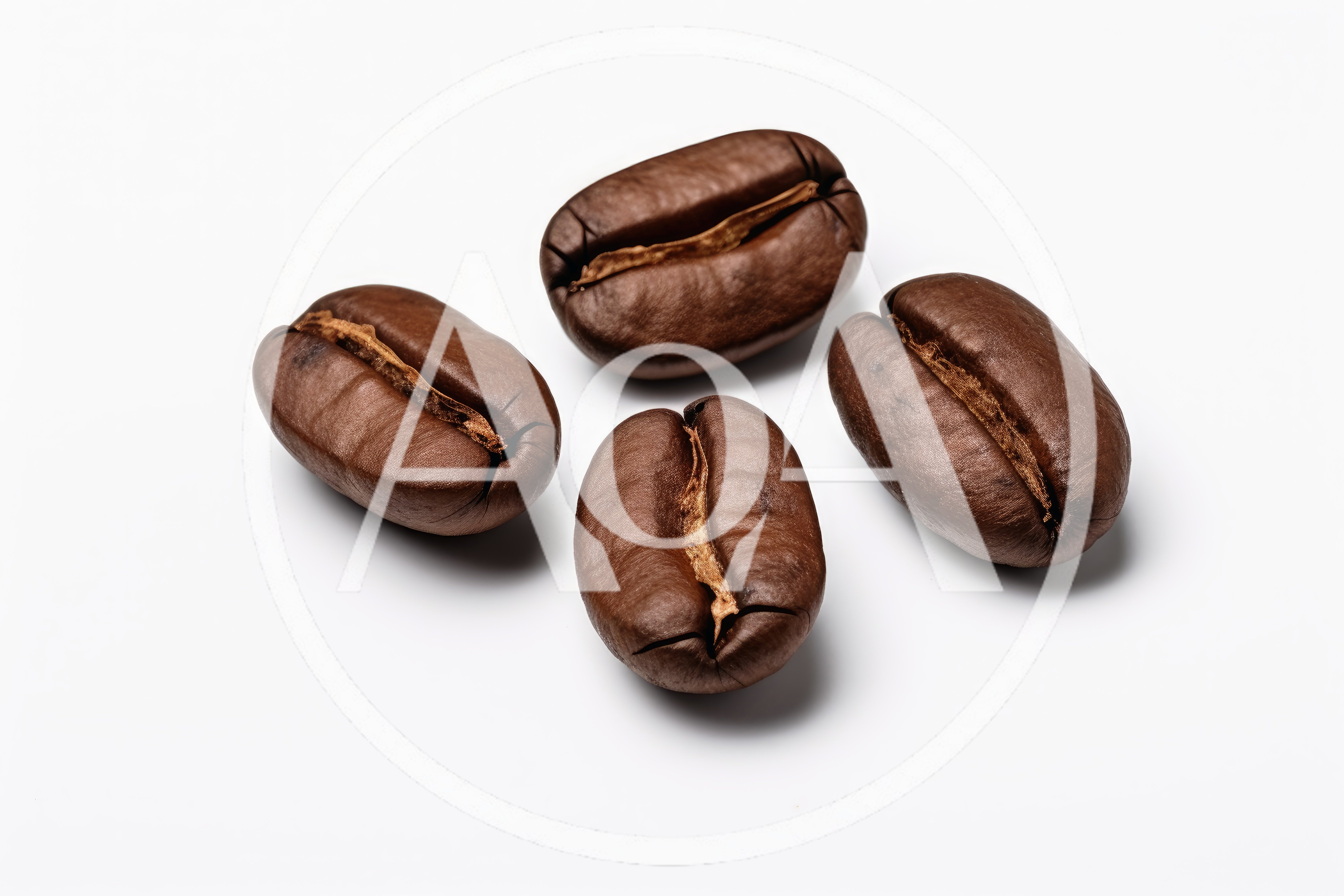 Four Roasted Coffee Beans On White Background