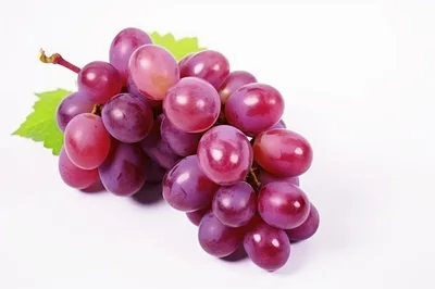 Fresh Red Grapes With Green Leaves On White Background
