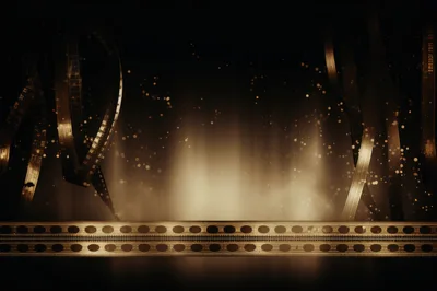 Golden Cinematic Film Strips With Glowing Bokeh Background