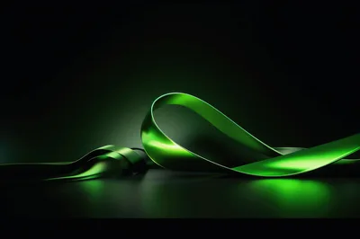 Abstract Green Metallic Ribbon Flowing On Dark Background