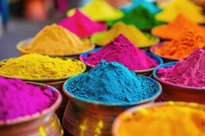 Vibrant Colored Holi Powder Piles in Clay Bowls