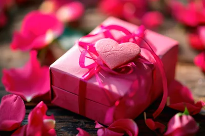 Pink Gift Box With Heart Ornament And Rose Petals