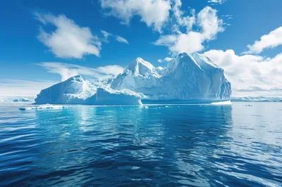 Massive Iceberg Floating In The Calm Antarctic Ocean
