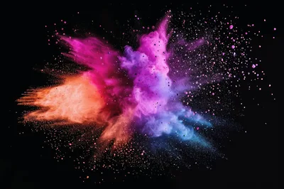 Vibrant Multi-Colored Powder Explosion Against Black Background